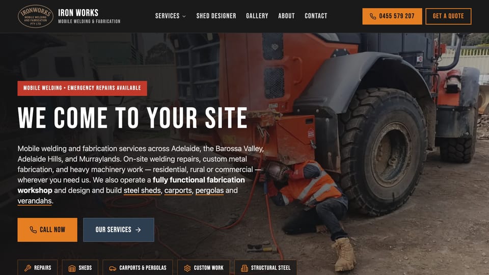 The Iron Works Mobile Welding homepage: a welder under an orange wheel loader beside the heading We come to your site