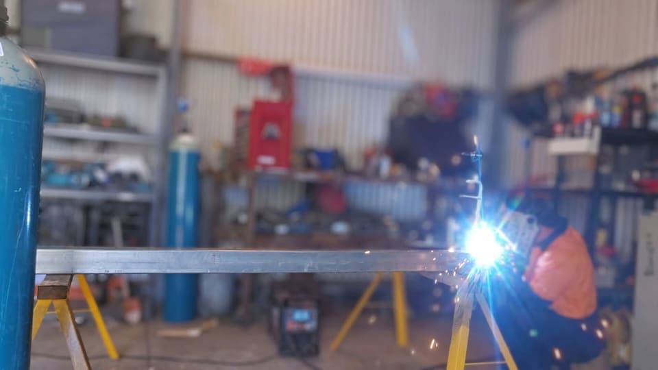 Iron Works Mobile Welding at work in the workshop, sparks flying from the weld