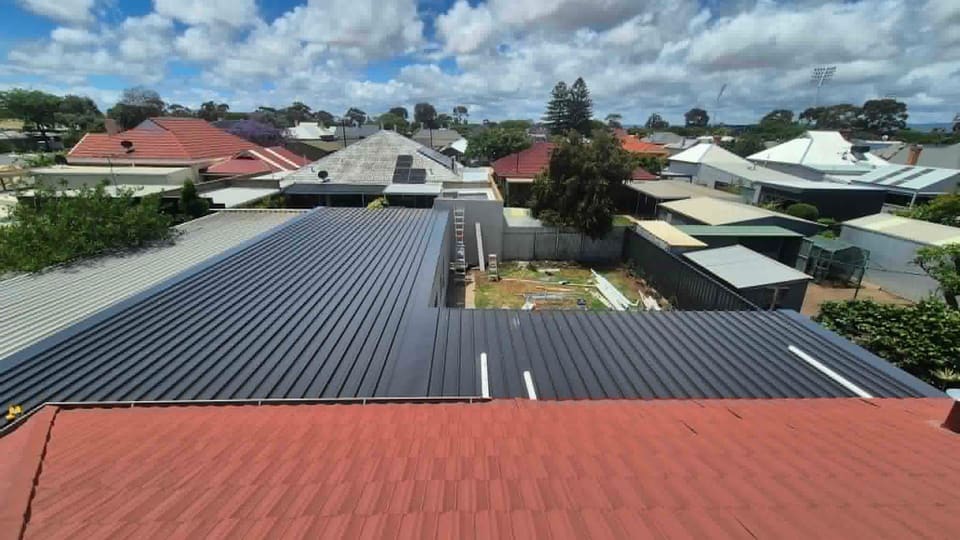 A new Colorbond roof by A1 Roofing, looking out over the neighbouring suburban rooftops