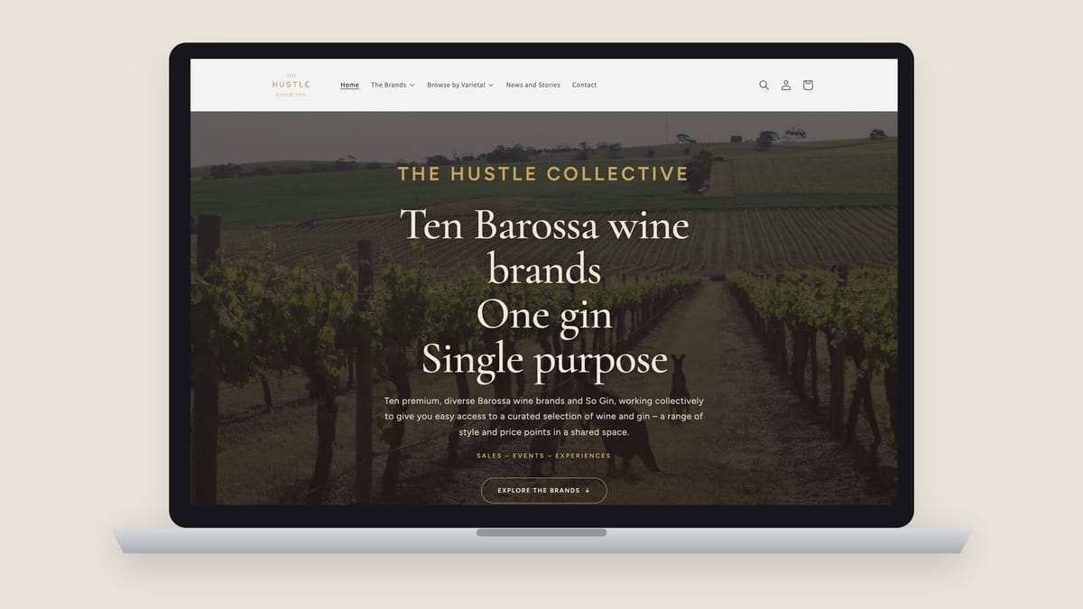 The Hustle Collective Shopify homepage on a laptop: ten Barossa wine brands, one gin, single purpose